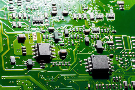 A close-up microchip with many electrical components placed on the Board. The background is blurred.