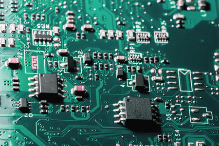 A close-up microchip with many electrical components placed on the Board. The background is blurred.