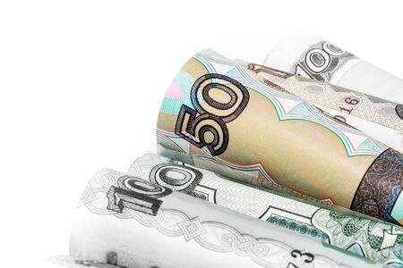 Rolled banknote of rubles of different denominations on a white background photographed close.の写真素材