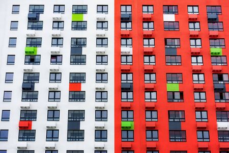 Multistorey new large apartment built of reinforced concrete. Under some Windows there is a platform for air conditioners.の写真素材