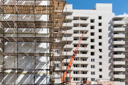 Multistorey new large apartment built of reinforced concrete. Under some Windows there is a platform for air conditioners.の写真素材