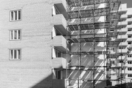 Multistorey new large apartment built of reinforced concrete. Under some Windows there is a platform for air conditioners.の写真素材