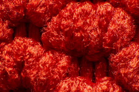 Synthetic fiber photos There is a space between the fibers. Tidy weave, red fiber, high magnification, super macroの写真素材