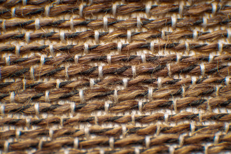 Synthetic fabric fibers for chairs, coarse fabrics, with gaps between fibers. Neat weave Large white-brown fibers , High magnification , Super macro.の写真素材