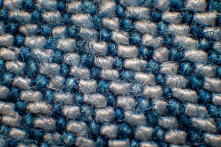 Synthetic fiber photos of denim There is a space between the fibers. Tidy weave, blue-white fibers, high magnification, super macro.の写真素材