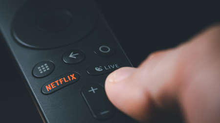 SMUTHPRAKARN / THAILAND - June 5 2021: Detail of remote control with a Netflix button. Netflix is an American company specializes in and provides streaming media and video on demand online.のeditorial素材