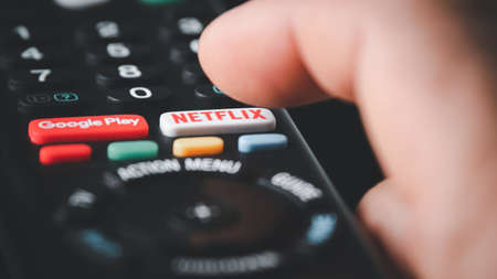 SMUTHPRAKARN / THAILAND - June 5 2021: Detail of remote control with a Netflix and google play button.There are American company specializes in and provides streaming media and video on demand online.のeditorial素材