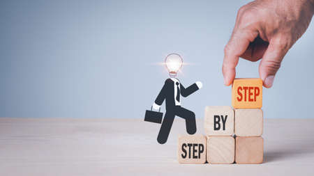 Business development to success and growing growth concept.Arrange wooden blocks into growing step by step.の写真素材