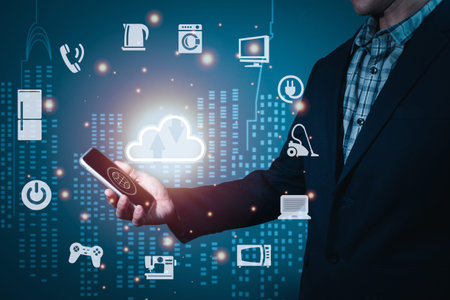 A man wearing a suit holding a cell phone On the screen there is a cloud symbol. And symbols for...