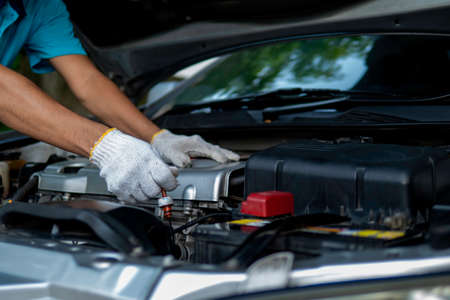 Auto mechanic working in garage. Repair serviceの写真素材