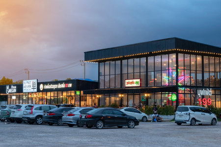 Editorial use only; Lots of people are in restaurants and parking centers during the evening sunset,...