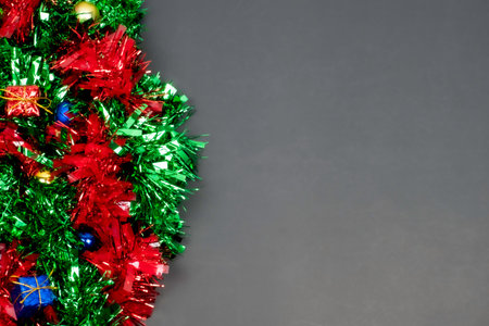 Christmas border template with fir branches, Beautiful red green blue and gold toys and ribbon,on...
