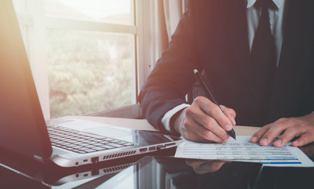 The concept is Signing a contract, business agreement, and deal concept. Businessman reading before...