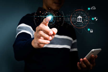 Businessmen use fingerprint identification access personal financial data.Biometrics security,  Idea for E-KYC (electronic know your customer),Innovation technology against digital cybercrime concept.の写真素材