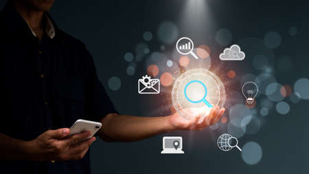 Search browsing internet connecting worldwide, hand-holding search icon business. Data search engine optimization browser webpage technology internet networking business concept,の写真素材