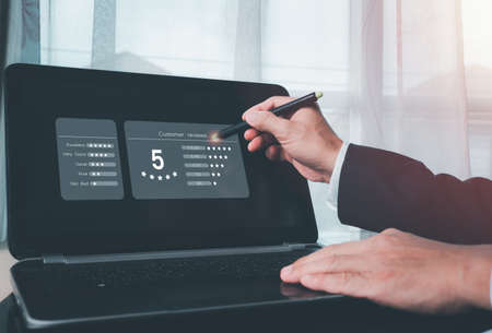 Customer gives rating to service, experience can evaluate a quality of service leading to reputation ranking of business on online application,Concept is Customer review satisfaction feedback survey.の写真素材