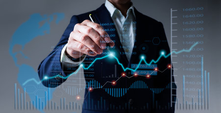 On a gray background, a businessman draws a growth graph and analyzes financial and investment data,...