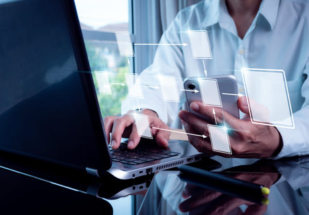 Flowchart-based business process and workflow automation. Holding a mobile phone and configuring...