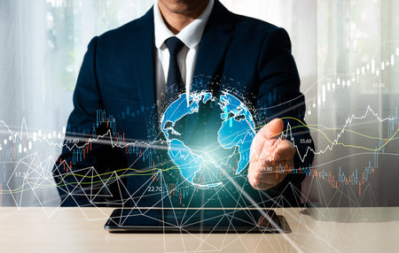 A businessman's hand grasps a global network, a global corporation, an internet network connection,...