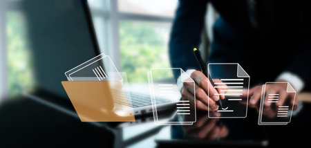 Paperless office, e-signatures, electronic signatures, and document management A businessman signs...