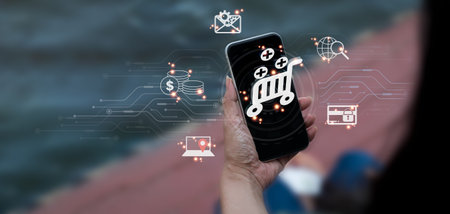 The lady uses her cell phone to communicate digital marketing, social media ads, e-commerce, online...