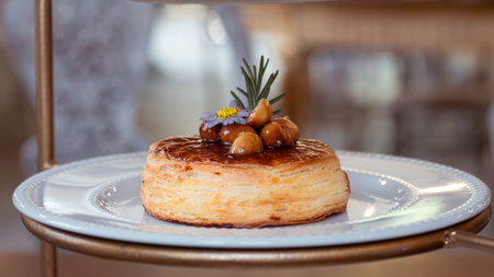 cake prepared with macadamia nuts. Very nice. icing on a chocolate cake
