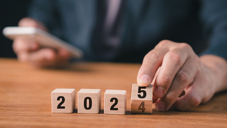 2024 Review of customers and the company in establishing the business strategy for the next year 2025 2024â2025 flip of wooden blocks. year-end business concepts.の写真素材