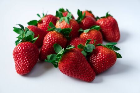 Strawberries with strawberry leaf on white backgroundの写真素材