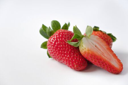 Strawberries with strawberry leaf on white backgroundの写真素材