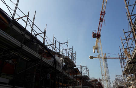 Work in progress on the construction site in the summer to build houses and officesの写真素材