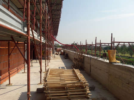 Work in progress on the construction site to build houses and officesのeditorial素材