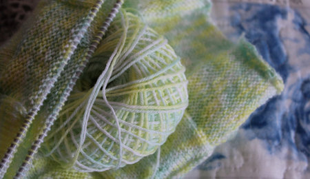 Ball of green and yellow wool - fashion