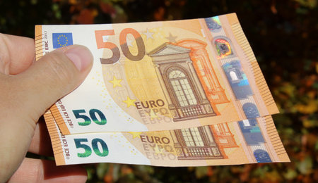 Counting 50 euro banknotes - wealth