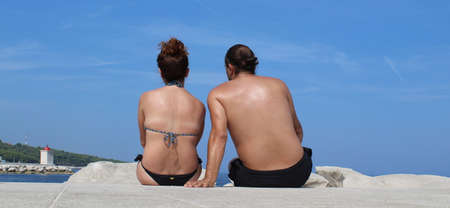 Tourist couple on beach vacation in summerの写真素材