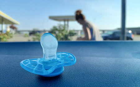 Pacifier of a newborn on the tableの写真素材