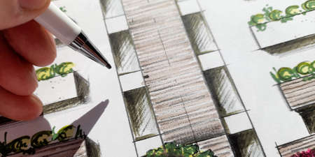 Architect drawing the facade of the condominiumの写真素材