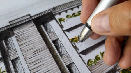Architect drawing the facade of the condominiumの写真素材
