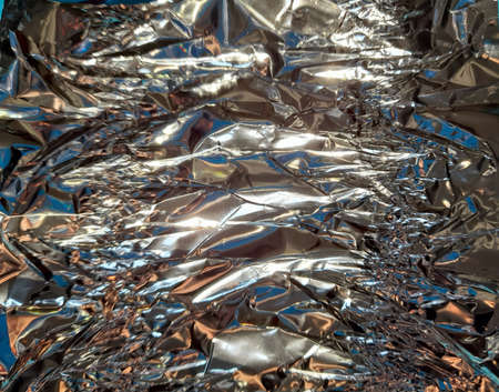 Crumpled aluminum foil for backgroundの写真素材