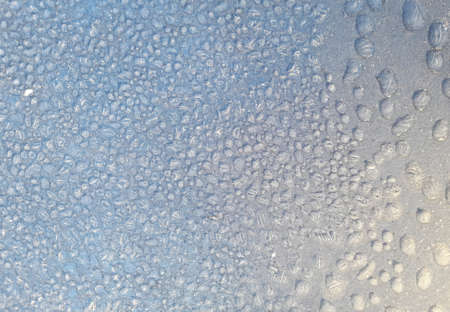 Drops of water on a metal surfaceの写真素材