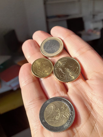 Coins of 2 euros, 1 euro, 50 cents and 10 cents - poverty or wealth?