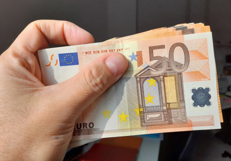 50 euro banknotes in the hands of a wealthy personの写真素材