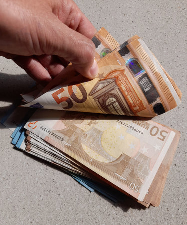 50 euro banknotes in the hands of a wealthy MAN