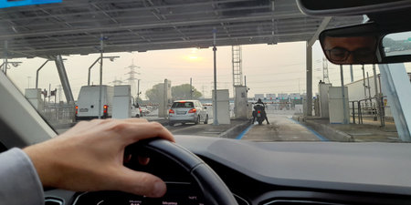 Man driving a car on the highway