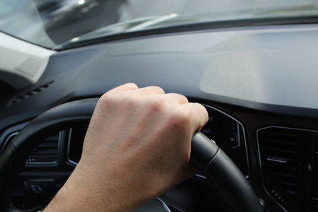 Man behind the wheel of his own car