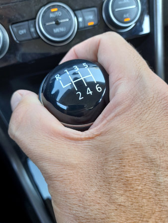 Driver changing gear on his carの写真素材