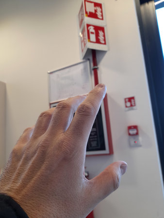 Fire alarm button in a public placeの写真素材
