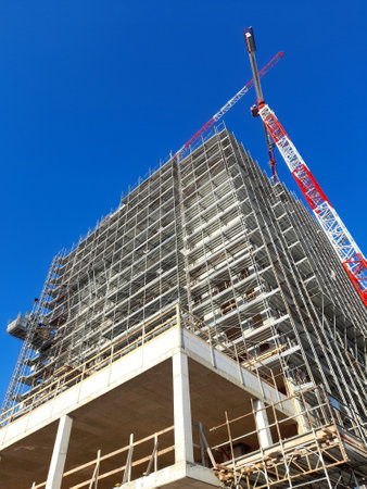 Work in progress at the construction site in winterの写真素材