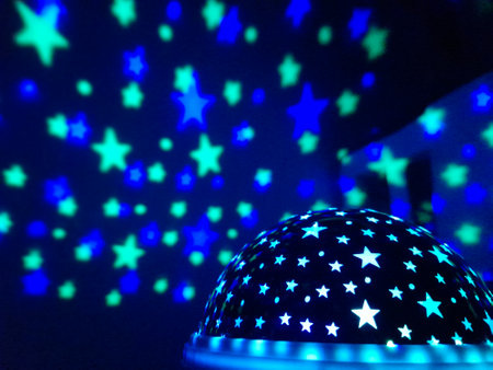 Starry sky in a child's room - green and blue lampの写真素材