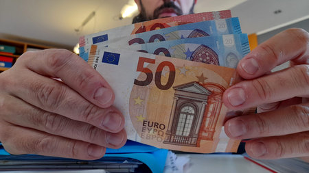 50 Euro Banknotes in the Hands of a Person