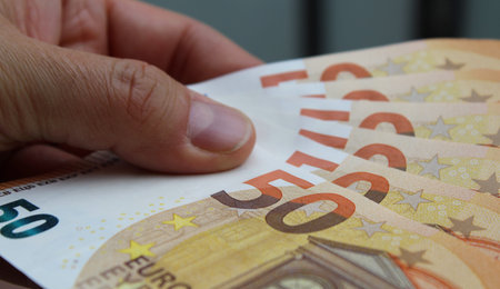 50 Euro Banknotes in Man's Hands